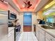 Modern kitchen with stainless steel appliances and light cabinets at 8015 Pequena Dr, Port Richey, FL 34668