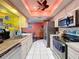 Modern kitchen with stainless steel appliances and light cabinets at 8015 Pequena Dr, Port Richey, FL 34668