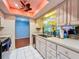 Bright kitchen with stainless steel appliances and light cabinets at 8015 Pequena Dr, Port Richey, FL 34668