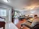 Living room with hardwood floors and couches at 8015 Pequena Dr, Port Richey, FL 34668
