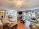 Spacious living room with hardwood floors and ample natural light at 8015 Pequena Dr, Port Richey, FL 34668