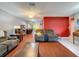 Spacious living room with hardwood floors and comfy brown couches at 8015 Pequena Dr, Port Richey, FL 34668
