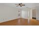 Bedroom with wood floors, a ceiling fan, and a window at 8154 Giffen Ln, Spring Hill, FL 34608