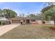 Single-story house with a two-car garage and landscaped yard at 8154 Giffen Ln, Spring Hill, FL 34608