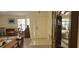 Bright entryway with tile flooring and a wooden cabinet at 8213 Reynolds, Hudson, FL 34667