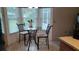 Bright kitchen nook with a glass-top table and chairs at 8213 Reynolds, Hudson, FL 34667