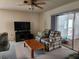 Living room featuring a plaid couch and coffee table at 8213 Reynolds, Hudson, FL 34667