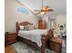 Spacious main bedroom with wood furniture and ceiling fan at 9139 Rhett Ln, Weeki Wachee, FL 34613