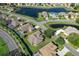 Aerial view showcasing a neighborhood with houses near a lake at 9398 Burnam Dr, Weeki Wachee, FL 34613