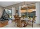 Casual dining area with glass-top table and view of the patio at 9398 Burnam Dr, Weeki Wachee, FL 34613