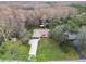 Aerial view of a cozy home nestled among lush trees and landscaping at 10200 Casey Dr, New Port Richey, FL 34654