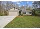 Charming single-story home featuring a stone facade and well-maintained front yard at 10200 Casey Dr, New Port Richey, FL 34654