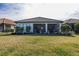 Home exterior showcasing a large backyard at 11061 Egeria Dr, Odessa, FL 33556