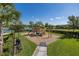 playground with play structures and wood chips at 11061 Egeria Dr, Odessa, FL 33556