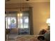 Bedroom with sliding glass doors leading to patio at 11203 Pembridge Ct # 1, Port Richey, FL 34668