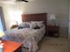 Spacious Primary bedroom with a king-size bed and nightstand at 11203 Pembridge Ct # 1, Port Richey, FL 34668
