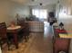 Cozy dining area with wood table and seating for four at 11203 Pembridge Ct # 1, Port Richey, FL 34668
