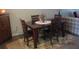 Simple dining area with a four-person table at 11203 Pembridge Ct # 1, Port Richey, FL 34668