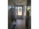 Bright entryway with tile flooring and coat hooks at 11203 Pembridge Ct # 1, Port Richey, FL 34668