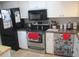 Bright kitchen features stainless steel appliances and ample counter space at 11203 Pembridge Ct # 1, Port Richey, FL 34668