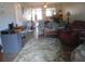 Living room with comfortable seating and access to dining area at 11203 Pembridge Ct # 1, Port Richey, FL 34668