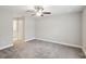 Spacious bedroom with ceiling fan and neutral decor at 11314 Humber Rd, Weeki Wachee, FL 34614