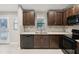 Modern kitchen with granite countertops and a double sink at 11314 Humber Rd, Weeki Wachee, FL 34614