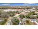 Aerial view of house, neighborhood, and lake at 12529 Shadow Ridge Blvd, Hudson, FL 34669