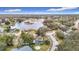 Community overview featuring lakefront property and surrounding homes at 12529 Shadow Ridge Blvd, Hudson, FL 34669