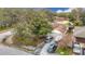 Home with driveway, boat, and surrounding trees at 12529 Shadow Ridge Blvd, Hudson, FL 34669