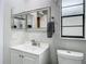 Well-appointed bathroom with a vanity, toilet, and mirror at 12529 Shadow Ridge Blvd, Hudson, FL 34669