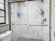 Updated bathroom with a walk-in shower, modern vanity, and stylish tile at 12529 Shadow Ridge Blvd, Hudson, FL 34669