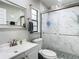 Clean and bright bathroom featuring a glass shower and updated fixtures at 12529 Shadow Ridge Blvd, Hudson, FL 34669