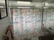 Bathroom with nautical-themed shower curtain at 12529 Shadow Ridge Blvd, Hudson, FL 34669