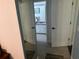 Bathroom with double doors and a view of the vanity at 12529 Shadow Ridge Blvd, Hudson, FL 34669