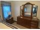 Bedroom with a dresser and a large mirror at 12529 Shadow Ridge Blvd, Hudson, FL 34669