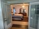 Bedroom with double doors leading to other areas of the house at 12529 Shadow Ridge Blvd, Hudson, FL 34669