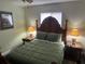 Bedroom with a double bed, nightstands and lamps at 12529 Shadow Ridge Blvd, Hudson, FL 34669