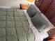 Bedroom with a double bed, nightstand, and wooden headboard at 12529 Shadow Ridge Blvd, Hudson, FL 34669
