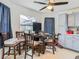 Small dining area with a table and four chairs, near the kitchen at 12529 Shadow Ridge Blvd, Hudson, FL 34669