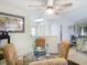 Dining room with glass table and view of living room at 12529 Shadow Ridge Blvd, Hudson, FL 34669