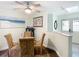 Dining room with glass table and beach themed art at 12529 Shadow Ridge Blvd, Hudson, FL 34669
