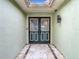 Entryway with double doors and tiled floor at 12529 Shadow Ridge Blvd, Hudson, FL 34669