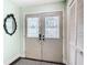 Interior entryway with double doors and mirror at 12529 Shadow Ridge Blvd, Hudson, FL 34669