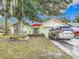 House exterior, featuring a fountain and red umbrella at 12529 Shadow Ridge Blvd, Hudson, FL 34669