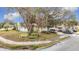 House exterior showcasing a well-maintained lawn, driveway, and landscaping at 12529 Shadow Ridge Blvd, Hudson, FL 34669