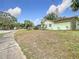 Light green house exterior with landscaping at 12529 Shadow Ridge Blvd, Hudson, FL 34669