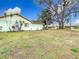 Side view of light green house exterior at 12529 Shadow Ridge Blvd, Hudson, FL 34669