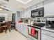 Updated kitchen featuring gray cabinets and stainless steel appliances at 12529 Shadow Ridge Blvd, Hudson, FL 34669