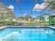 Inviting screened pool with a basketball hoop at 12529 Shadow Ridge Blvd, Hudson, FL 34669